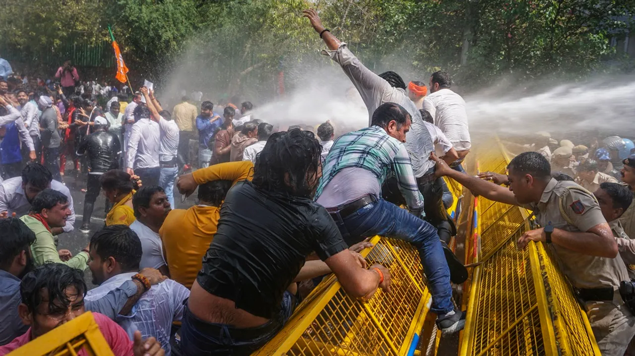 Water cannon being used on BJP workers protesting against Delhi Chief Minister Arvind Kejriwal demanding his resignation after he was recently arrested in connection with an excise policy-linked money-laundering case, in New Delhi, Tuesday, March 26, 2024