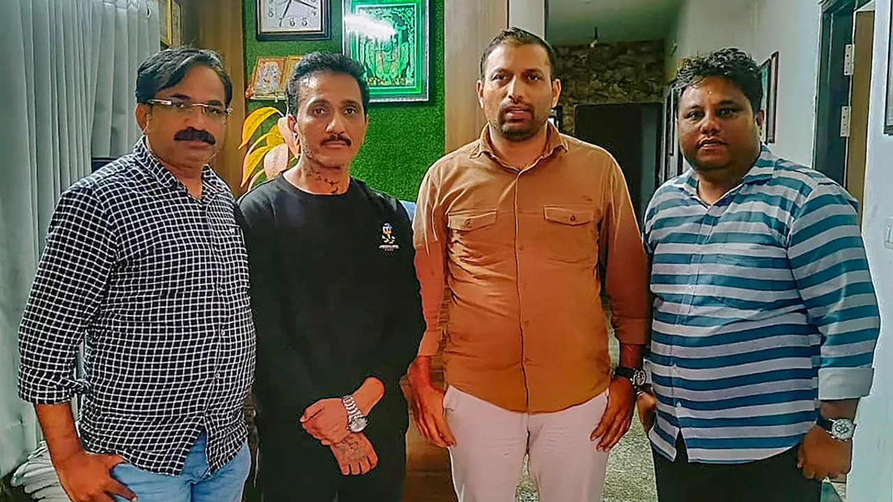 Mumbai Police Crime Branch personnel with the Director of Ego Media Pvt Ltd Bhavesh Bhinde (in black) after arresting him in connection with the giant billboard collapse that claimed at least 16 lives and injured 75 in an unexpected dust storm in Mumbai on Monday, in Udaipur, Thursday, May 16, 2024