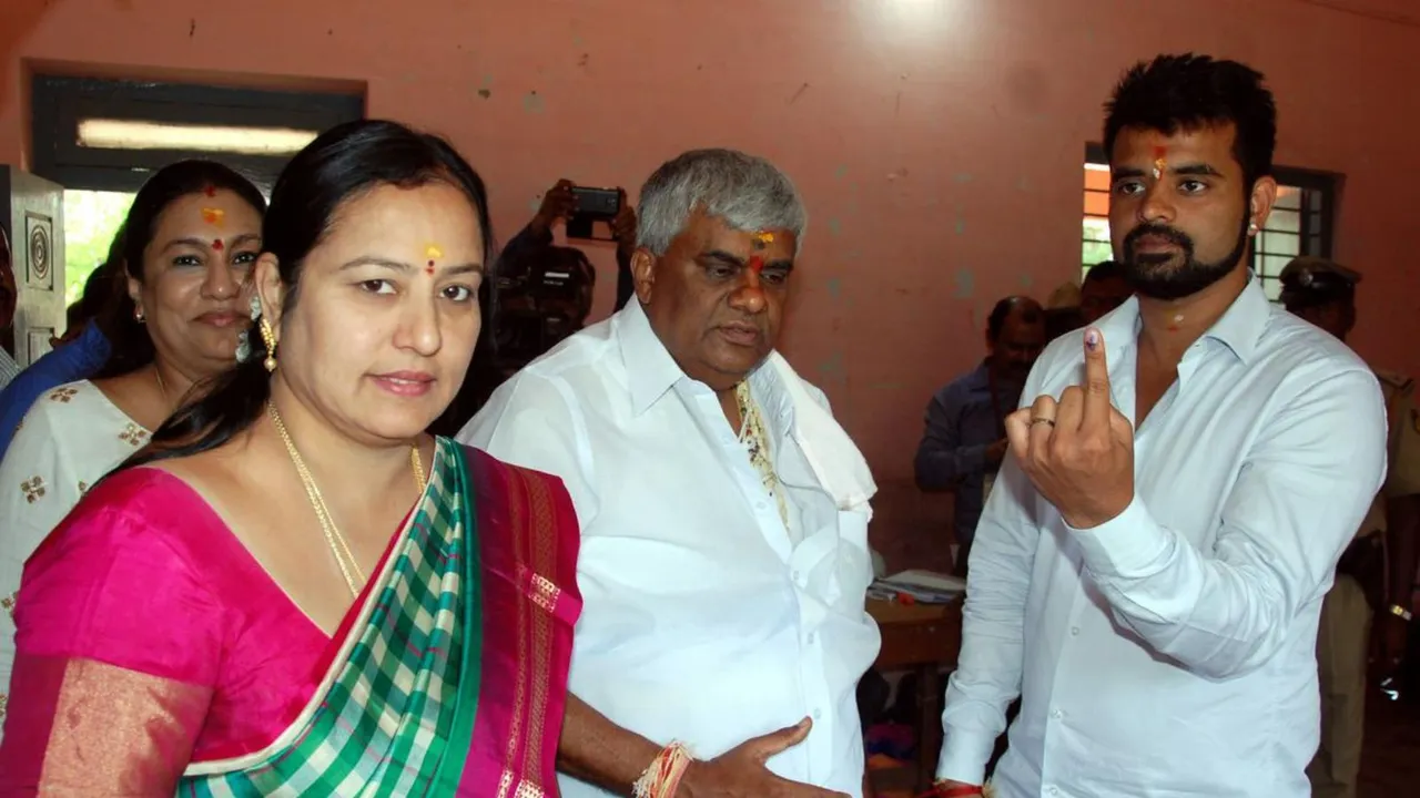 In a file photo Prajwal Revanna is seen with father H D Revanna and mother Bhavani
