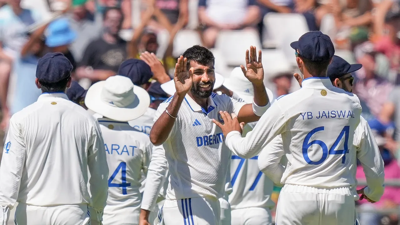 Jasprit Bumrah celebrates a wicket with teammates on the second day of the second Test cricket match between India and South Africa