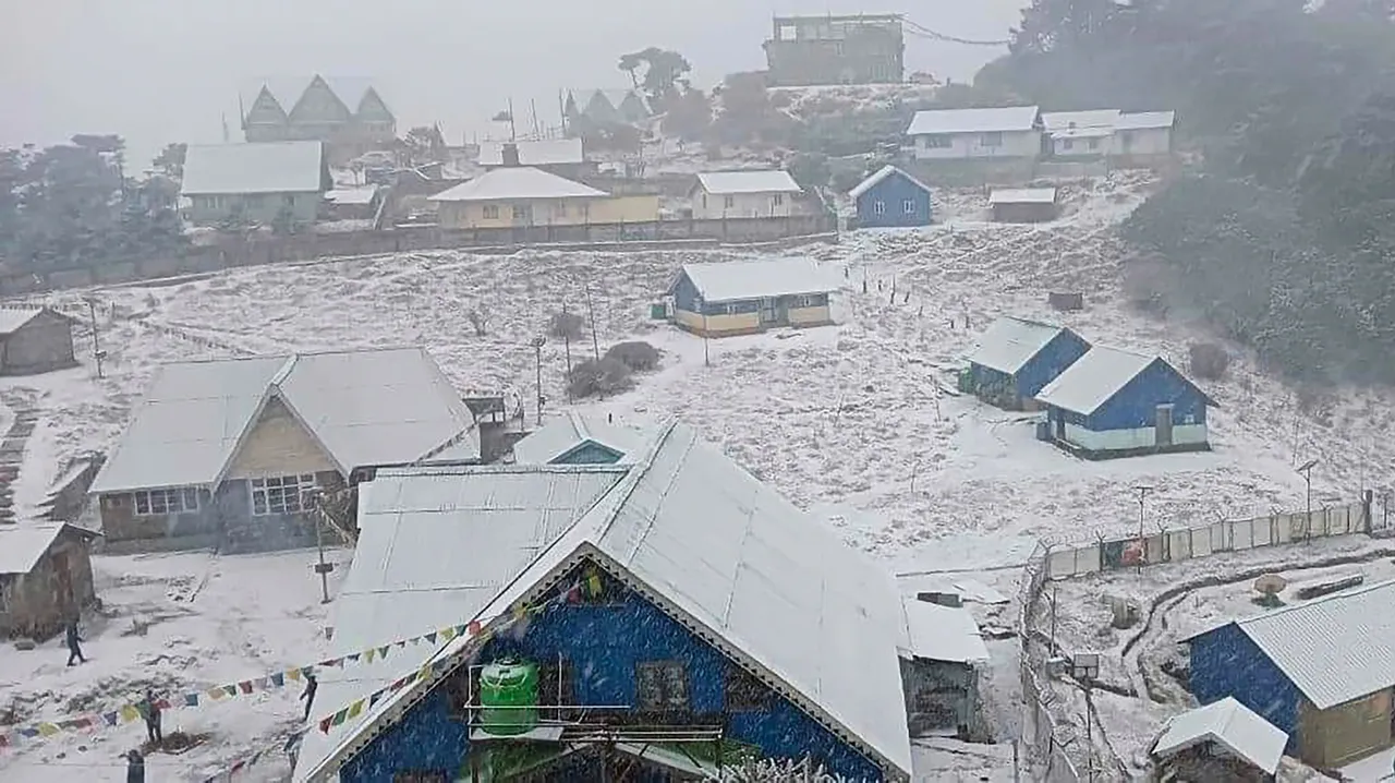 Houses are covered in snow after fresh snowfall at Sandakphu, in Darjeeling district