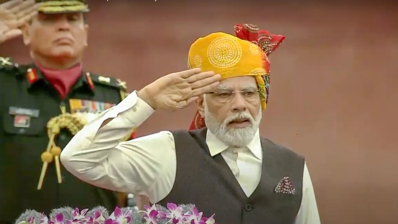 Prime Minister Narendra Modi salutes during the national anthem ahead of address to the country's 77th Independence Day, in New Delhi, Tuesday, Aug. 15, 2023
