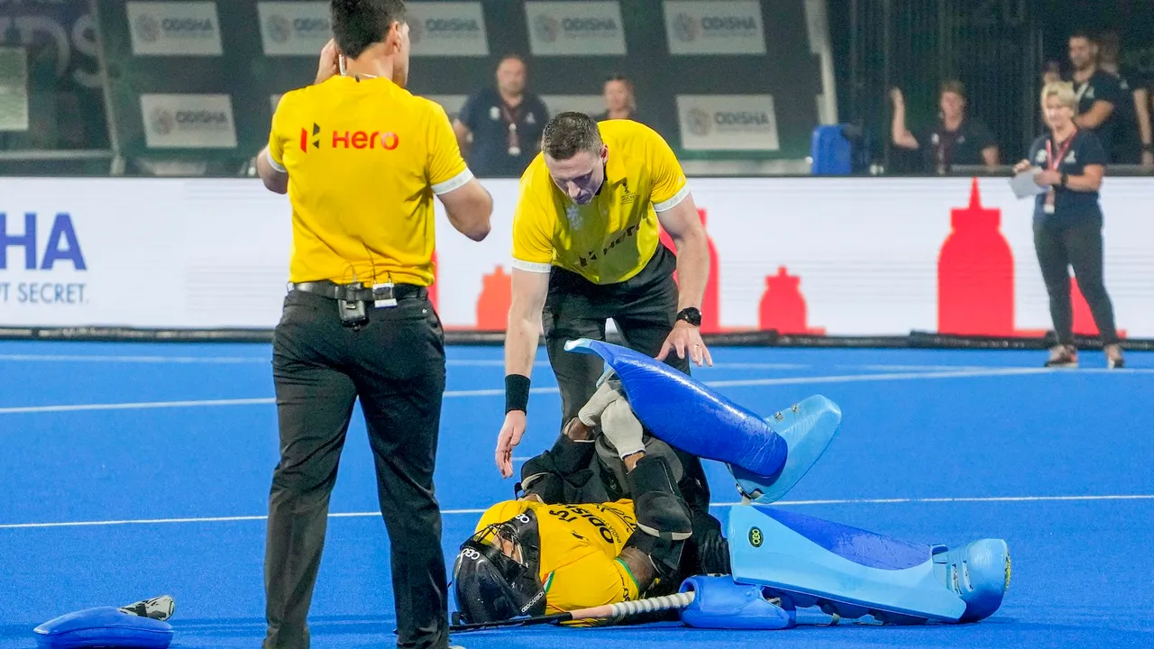Indian goalkeeper PR Sreejesh reacts in pain after getting injured during the penalty shootout against New Zealand, in the 2023 Men's FIH Hockey World Cup match in Bhubaneswar