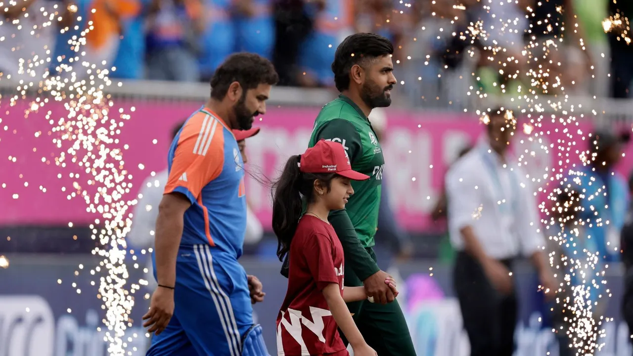 Pakistan's captain Babar Azam, right, and India's captain Rohit Sharma walk into the field before the start of the ICC Men's T20 World Cup cricket match between India and Pakistan