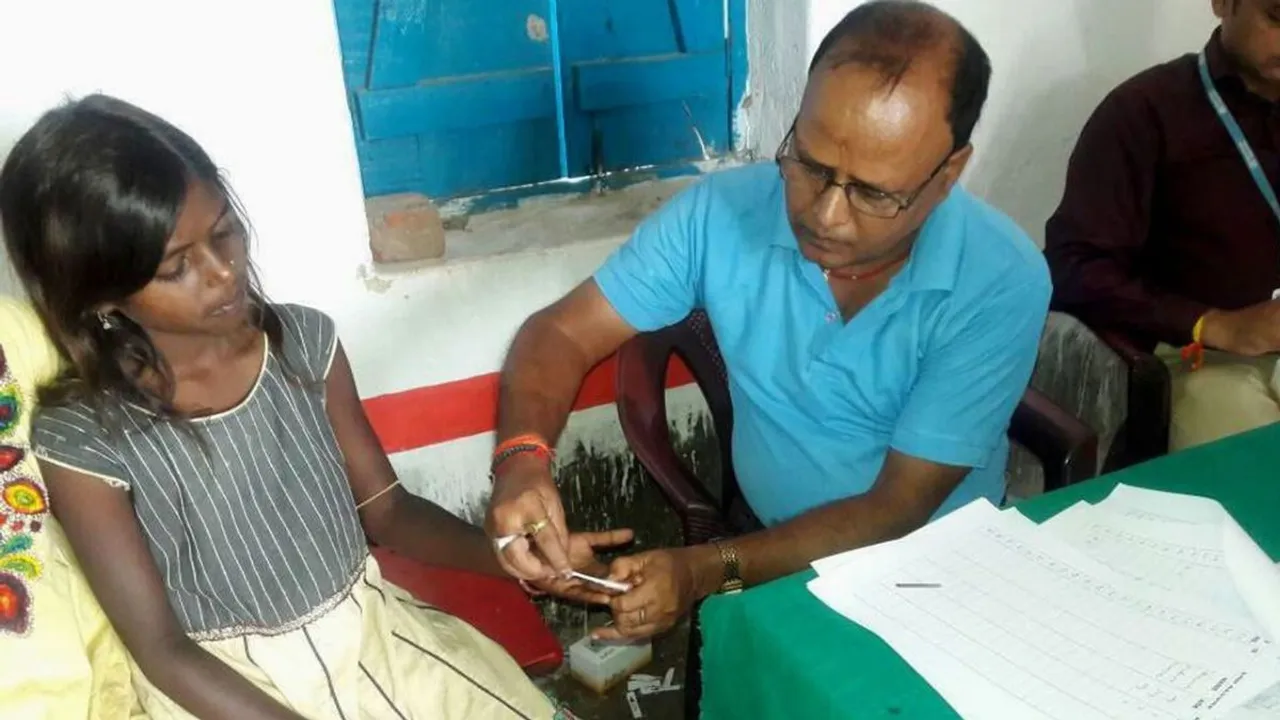 Health worker tests for kala azar in people of Kosra village