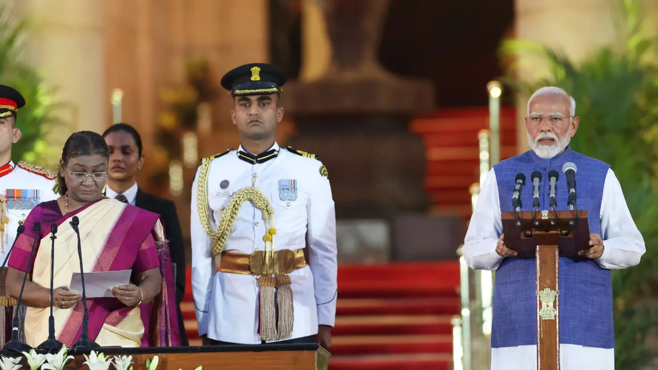 President Droupadi Murmu administers oath of office to Prime Minister-designate Narendra Modi, at the swearing-in ceremony held at Rashtrapati Bhavan, in New Delhi, Sunday, June 9, 2024.