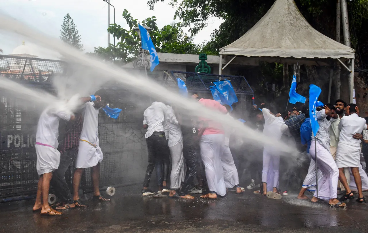 Police use water cannon to disperse Kerala Students Union (KSU) activists protesting outside the State Secretariat over the fake degree certificates controversy, in Thiruvananthapuram