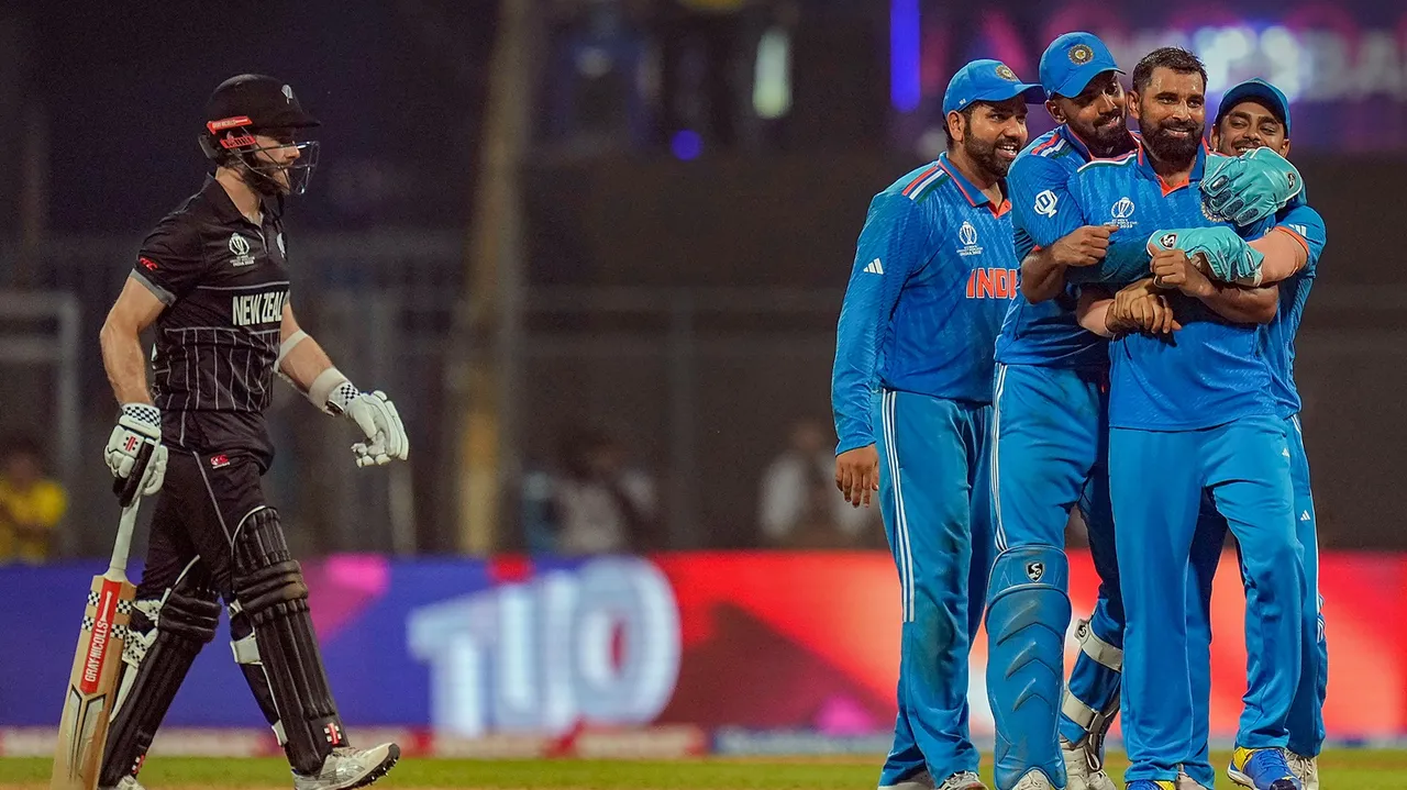 ndia's Mohammed Shami celebrates with teammates after taking the wicket of New Zealand's captain Kane Williamson during the ICC Men's Cricket World Cup 2023 first semi-final match