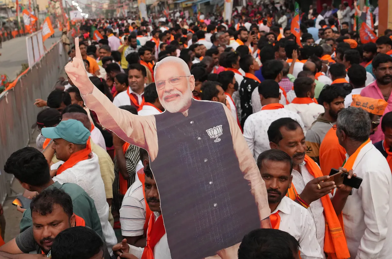 BJP Supporters during a roadshow of Prime Minister Narendra Modi for upcoming Assembly polls