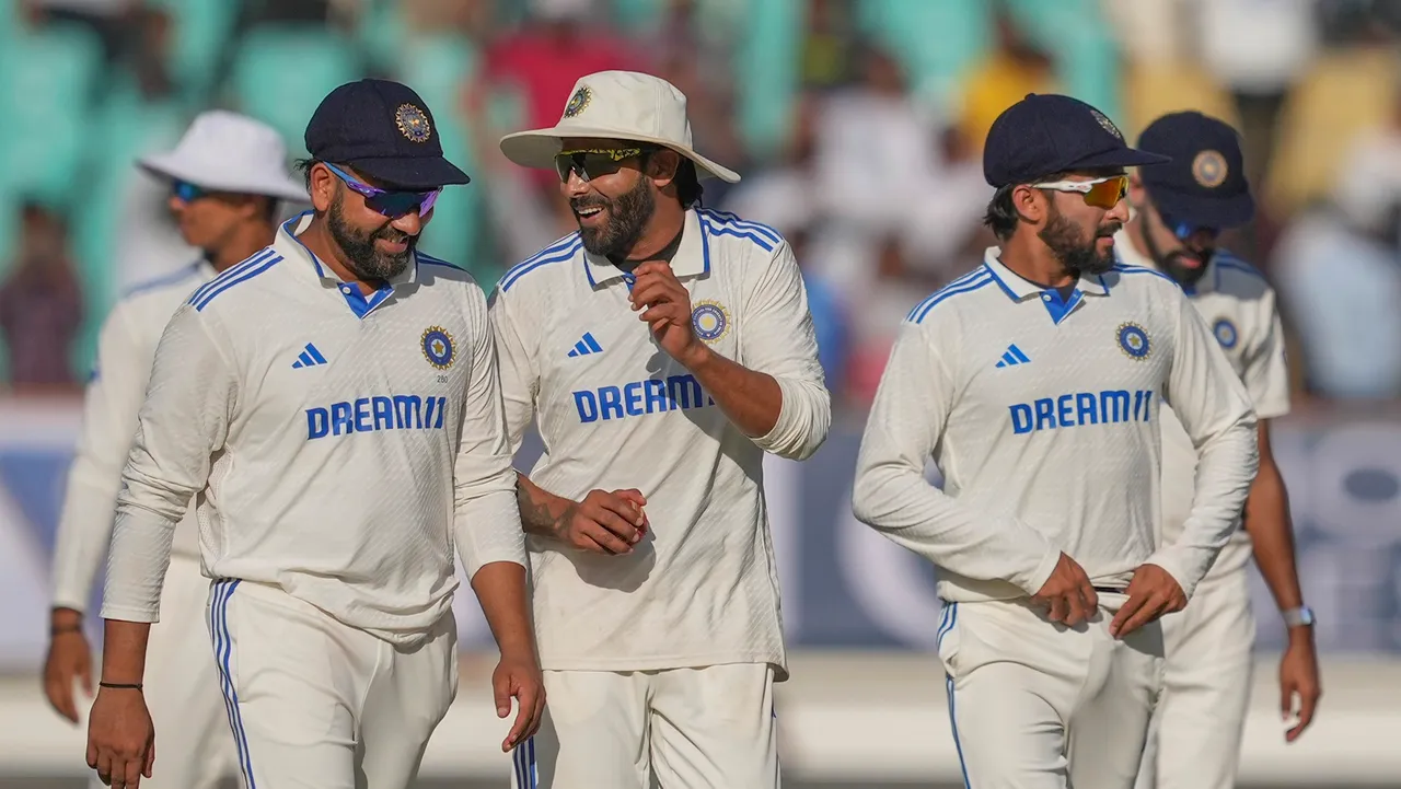 India's captain Rohit Sharma celebrates with Ravindra Jadeja and others after winning the match on the fourth day of the third test cricket match