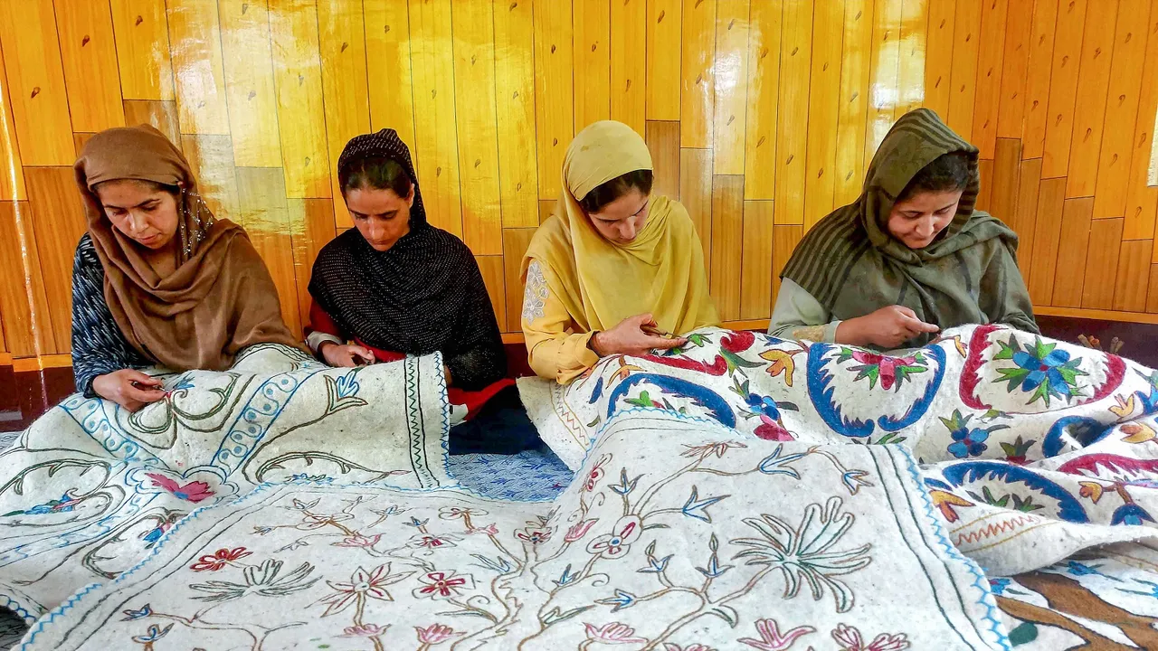 Women artisans make a Namda, the famed Kashmir woolen rug