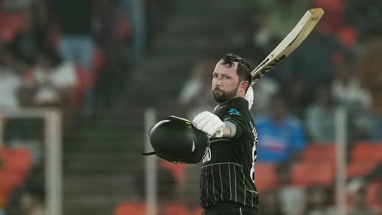 New Zealand's batter Devon Conway celebrates his century during the ICC Cricket World Cup match between England and New Zealand at Narendra Modi Stadium in Ahmedabad