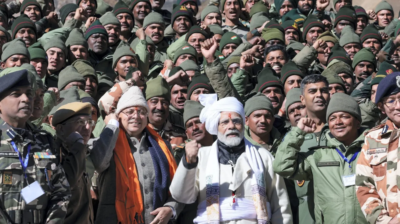 Prime Minister Narendra Modi with security forces personnel pose for group photos, in Pithoragarh district, Uttarakhand