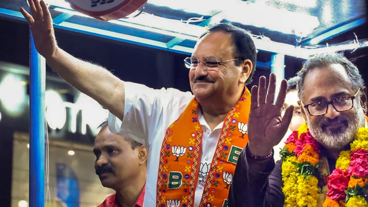 BJP President JP Nadda with Union Minister and BJP candidate Rajeev Chandrasekhar during a roadshow, ahead of the Lok Sabha elections, in Thiruvananthapuram, Friday, April 19, 2024
