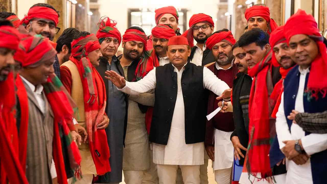 Leader Opposition Akhilesh Yadav with party MLAs arrive to attend the Budget session of UP Assembly at Vidhan Bhawan, in Lucknow