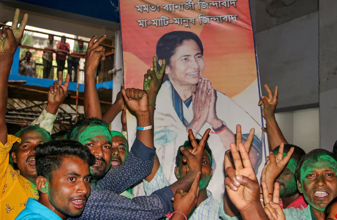 TMC workers and supporters celebrate the party's lead during the counting of votes of the West Bengal panchayat polls, in South Dinajpur district