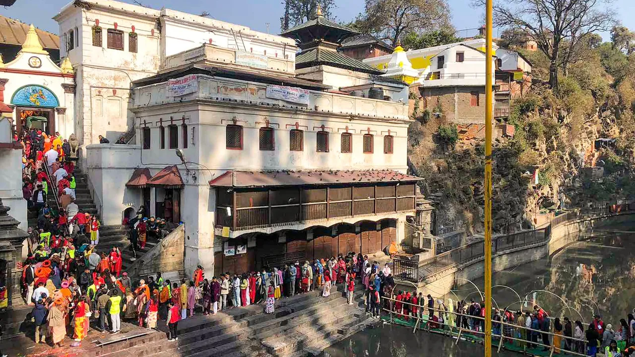 Devotees wait to offer prayers at the Pashupatinath Temple on Mahashivaratri festival, in Kathmandu