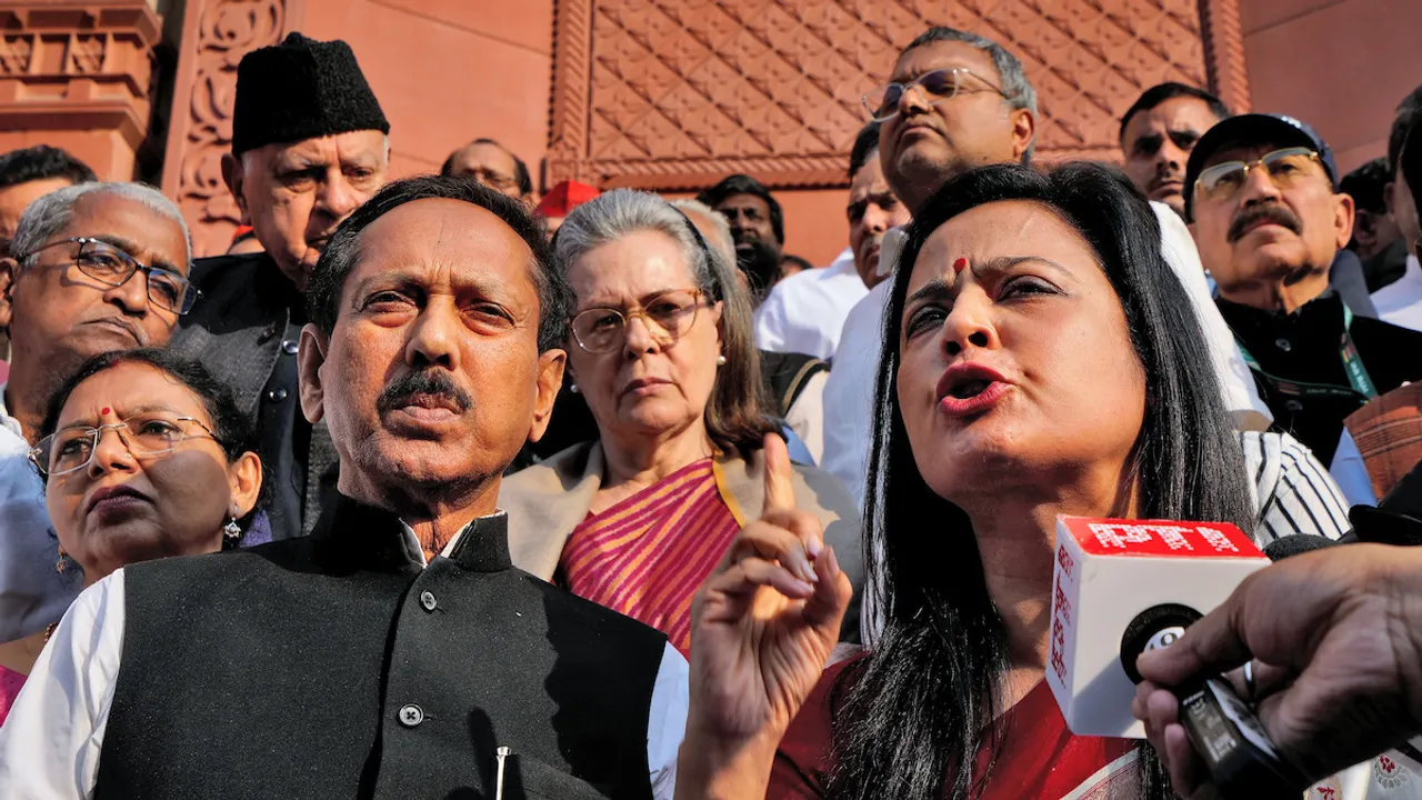 TMC leader Mahua Moitra speaks to the media after her expulsion from the Lok Sabha over cash-for-query issue during the Winter session of Parliament, in New Delhi, Friday, Dec. 8, 2023. Sonia Gandhi is also seen behind Moitra.