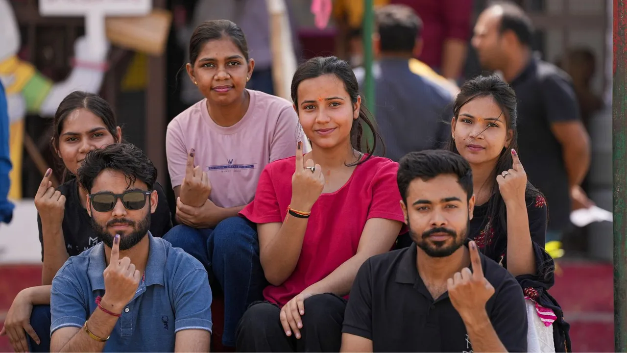 Young voters show their ink-marked fingers after casting their votes for the 2nd phase of Lok Sabha elections, in Meerut, Friday, April 26, 2024