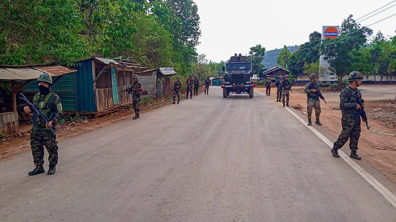 Army and Assam Rifles personnel conduct a flag march in violence-hit areas amid tribal groups' protest over court order on Scheduled Tribe status, Manipur, on May 5