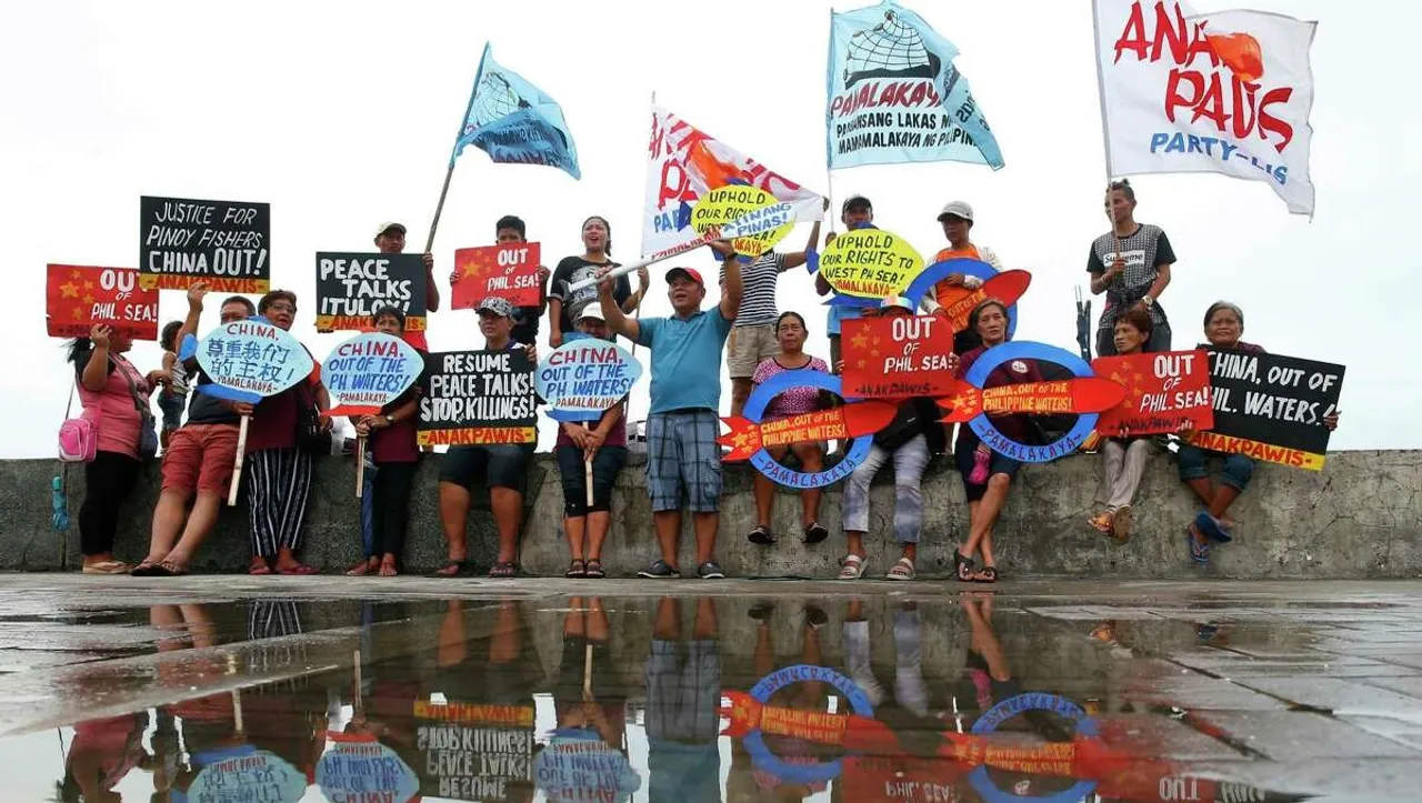 Philippines vows to remove floating barrier placed by China's coast guard at disputed lagoon