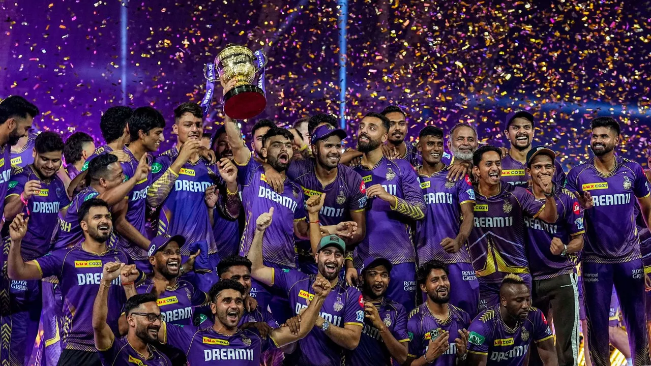 Kolkata Knight Riders players celebrate with the Indian Premier League (IPL) 2024 trophy after winning the final match against Sunrisers Hyderabad at MA Chidambaram Stadium, in Chennai, Sunday, May 26, 2024