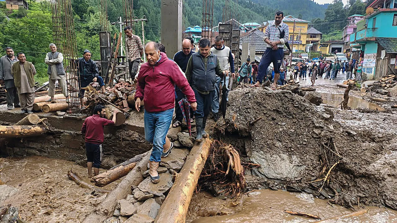 Former Himachal Pradesh Chief Minister Jai Ram Thakur inspects the flood-affected areas, in Mandi, Tuesday, July 11