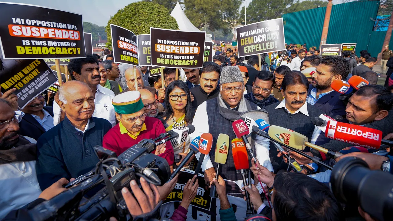 Leader of Opposition in the Rajya Sabha Mallikarjun Kharge speaks with the media at a protest over the suspension of opposition MPs during the Winter session of Parliament