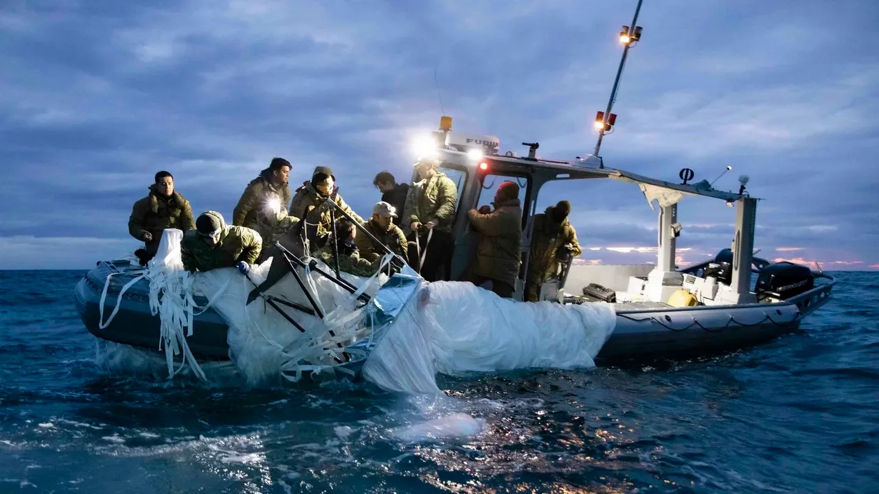 Sailors recover a high-altitude surveillance balloon in the waters off the coast of Myrtle Beach, S.C., on Feb. 5, after a fighter jet shot the balloon out of the sky.