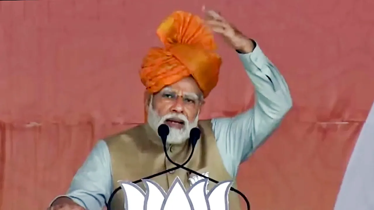 Prime Minister Narendra Modi speaks during a public meeting ahead of Rajasthan Assembly elections, in Baran