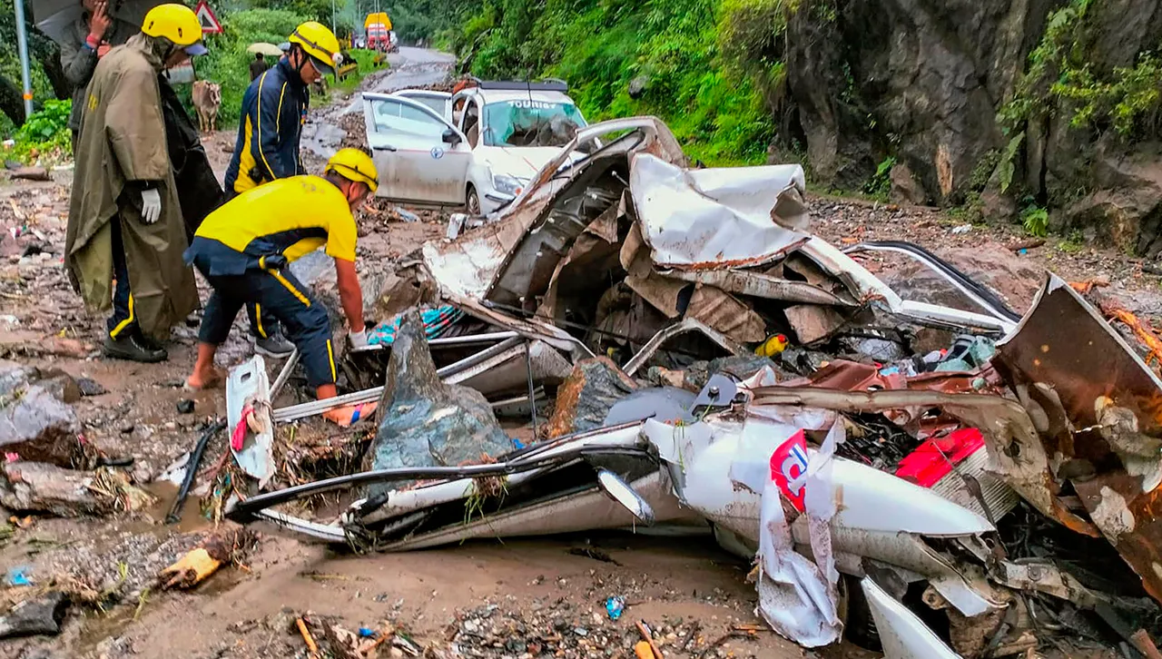 State Disaster Response Force (SDRF) personnel during a rescue and relief operation after vehicles were hit by falling debris after rain-triggered landslide on Uttarkashi-Gangotri highway, in Uttarkashi district, Tuesday, July 11
