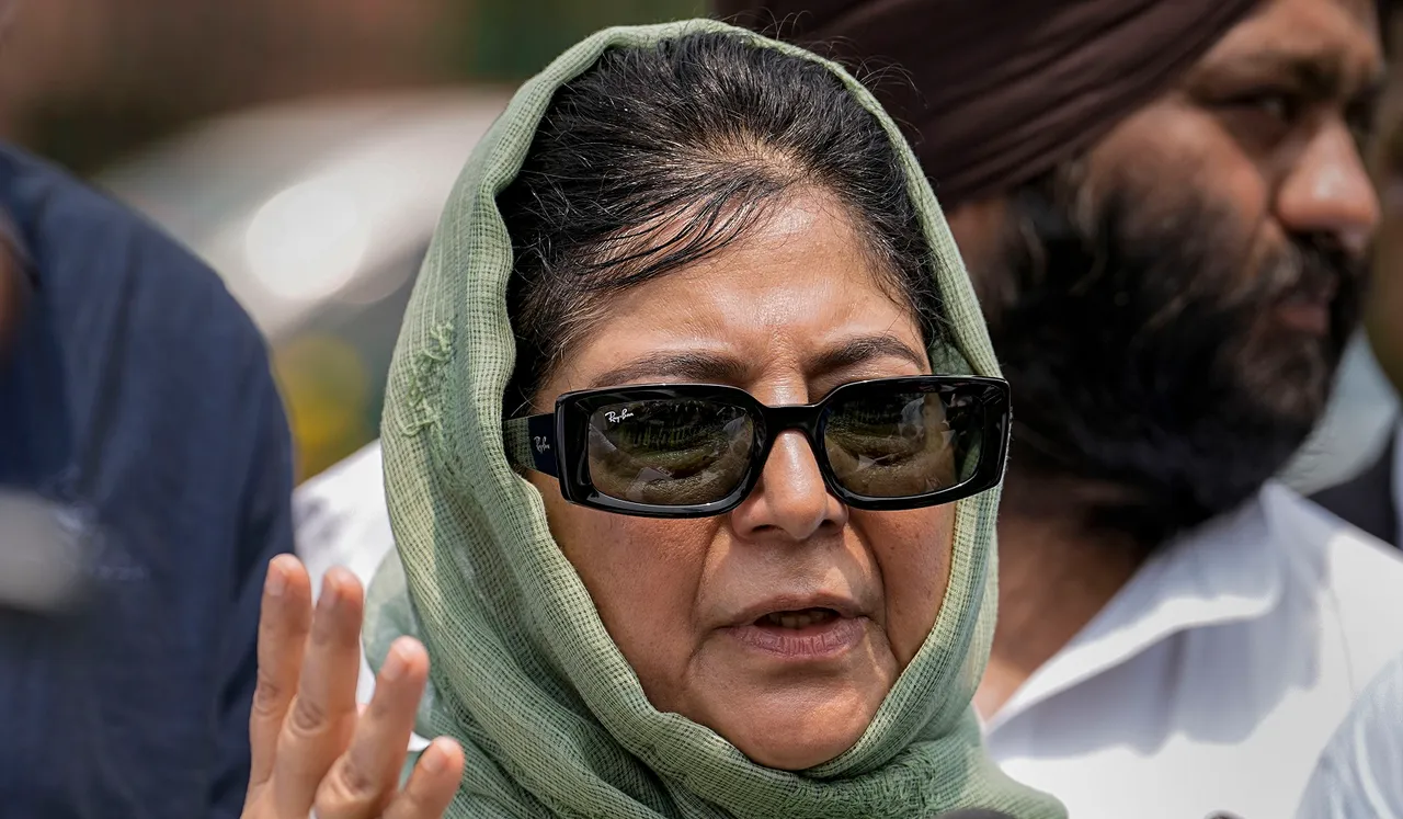 PDP chief Mehbooba Mufti interacts with the media after attending the constitution bench hearing on the abrogation of Article 370 at the Supreme Court complex