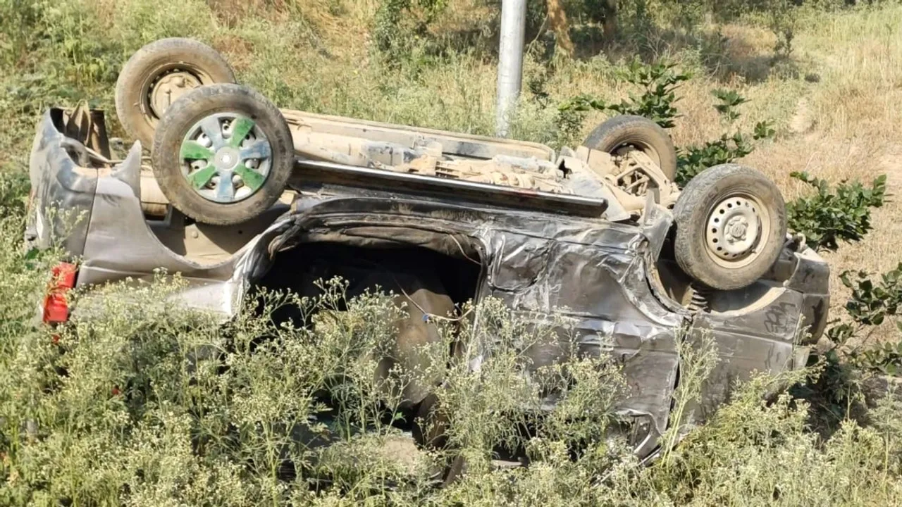 A damaged vehicle lies overturned after an accident at Bhognipur area, in Kanpur Dehat district, Wednesday, April 24, 2024
