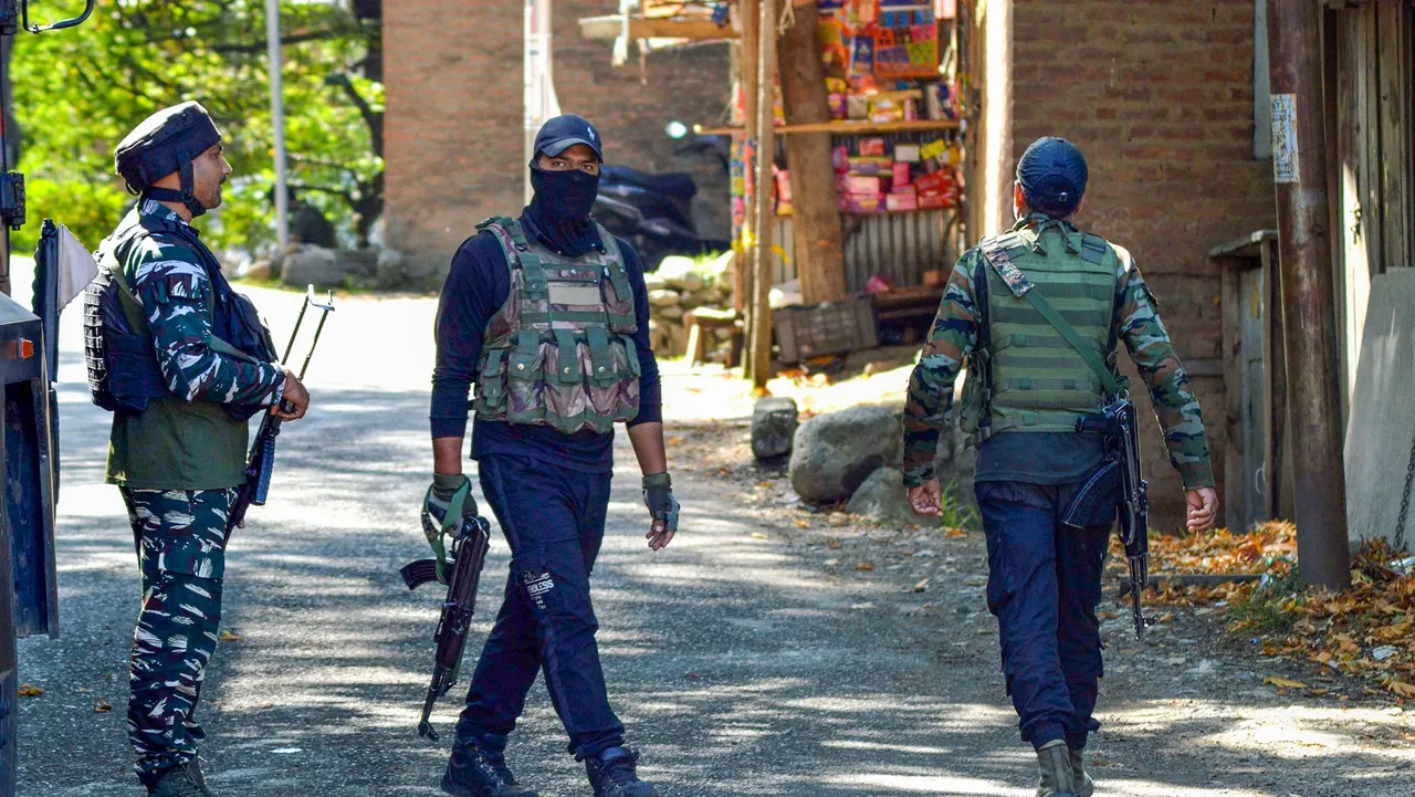 Security personnel guard near the encounter site on the sixth day of the ongoing encounter with terrorists, at Gadol Kokarnag in Anantnag district