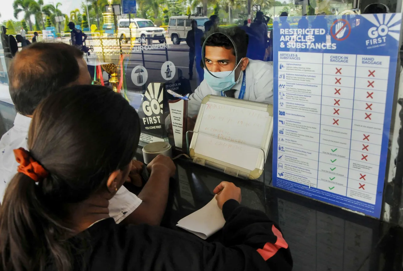 Passengers at a ticketing office of Go First airlines at Birsa Munda Airport in Ranchi