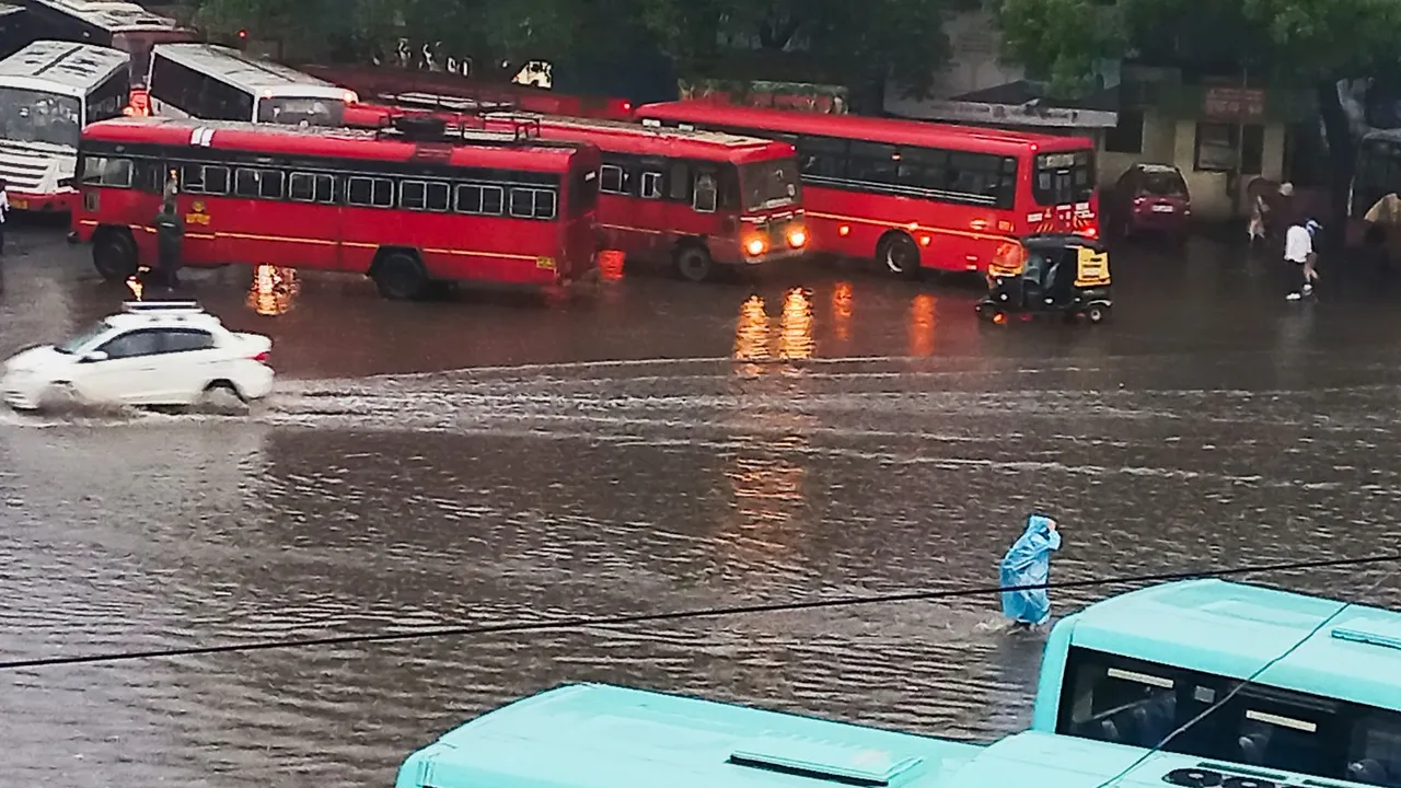 Commuters wade through a waterlogged road amid rains, in Pune, Saturday, June 8, 2024