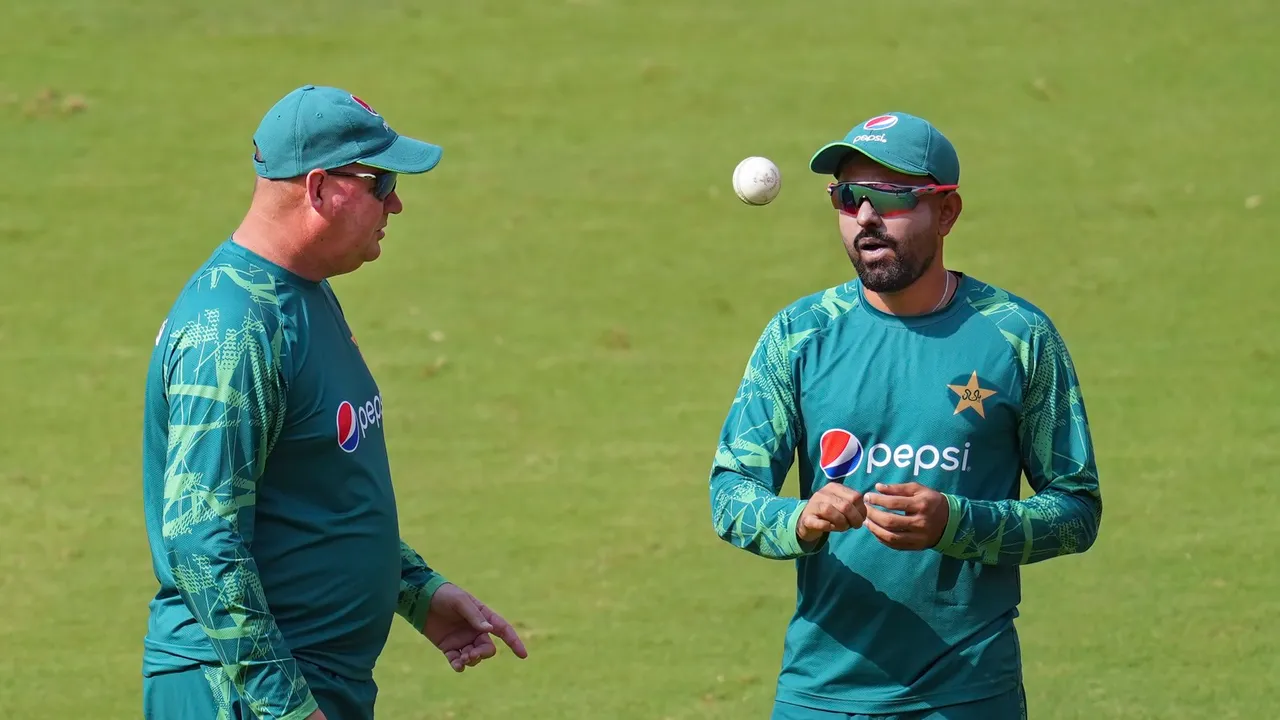 Pakistan cricket captain Babar Azam with coachduring a practice session ahead of the ICC Men's Cricket World Cup 2023 match between India and Pakistan