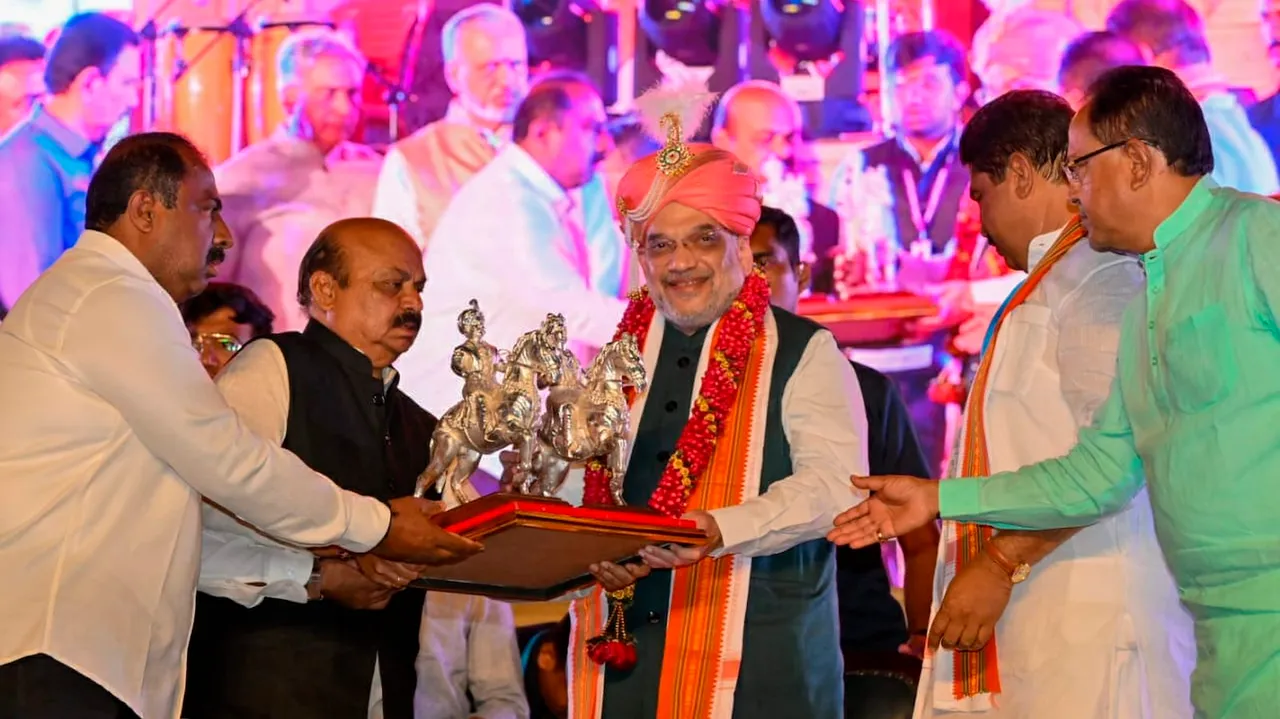 Union Home Minister Amit Shah receives a memento from Karnataka CM Basavaraj Bommai and others during the statue unveiling of 12th Century social reformer Basaveshwara and Bengaluru founder Nadaprabhu Kempe Gowda in front of Vidhanasoudha in Bengaluru on Sunday