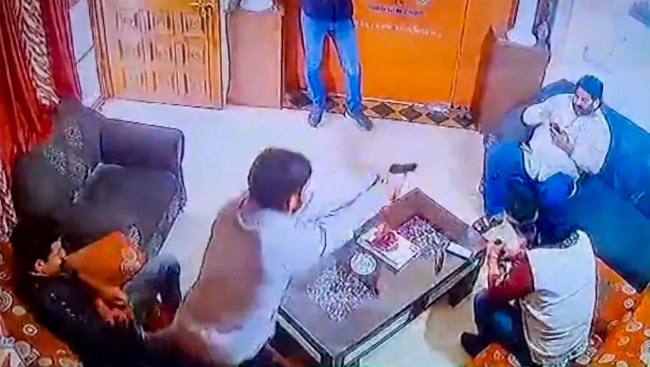 In this screenshot taken from a CCTV footage, Shri Rashtriya Rajput Karni Sena's president Sukhdev Singh Gogamedi being shot dead in the living room of his house, in Jaipur, Tuesday, Dec. 5, 2023.