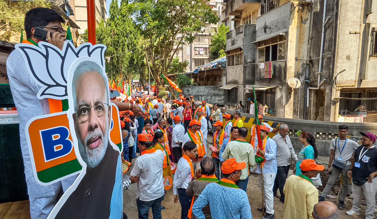 BJP supporters during Union Minister and party candidate Piyush Goyal's campaign road show for Lok Sabha polls, in Mumbai, Wednesday, May 15, 2024.