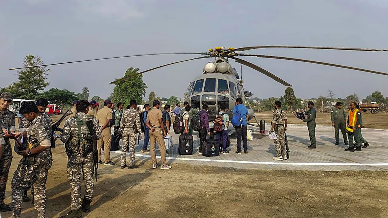 Security personnel and polling officials with election material leave for poll duty, ahead of Lok Sabha elections, in Gadchiroli, Tuesday, April 16, 2024.