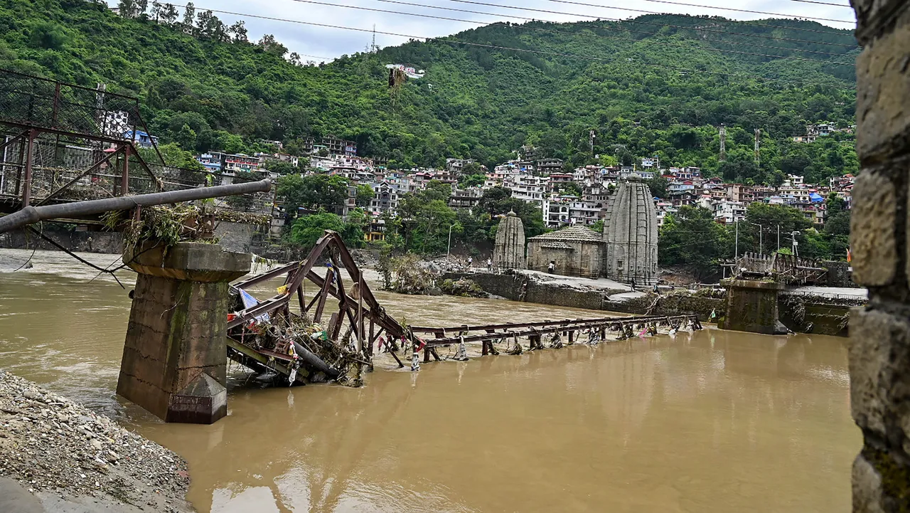 Broken bridge near the Panchvaktra Temple following heavy monsoon rains at a flood-affected area, in Mandi, Tuesday, July 11