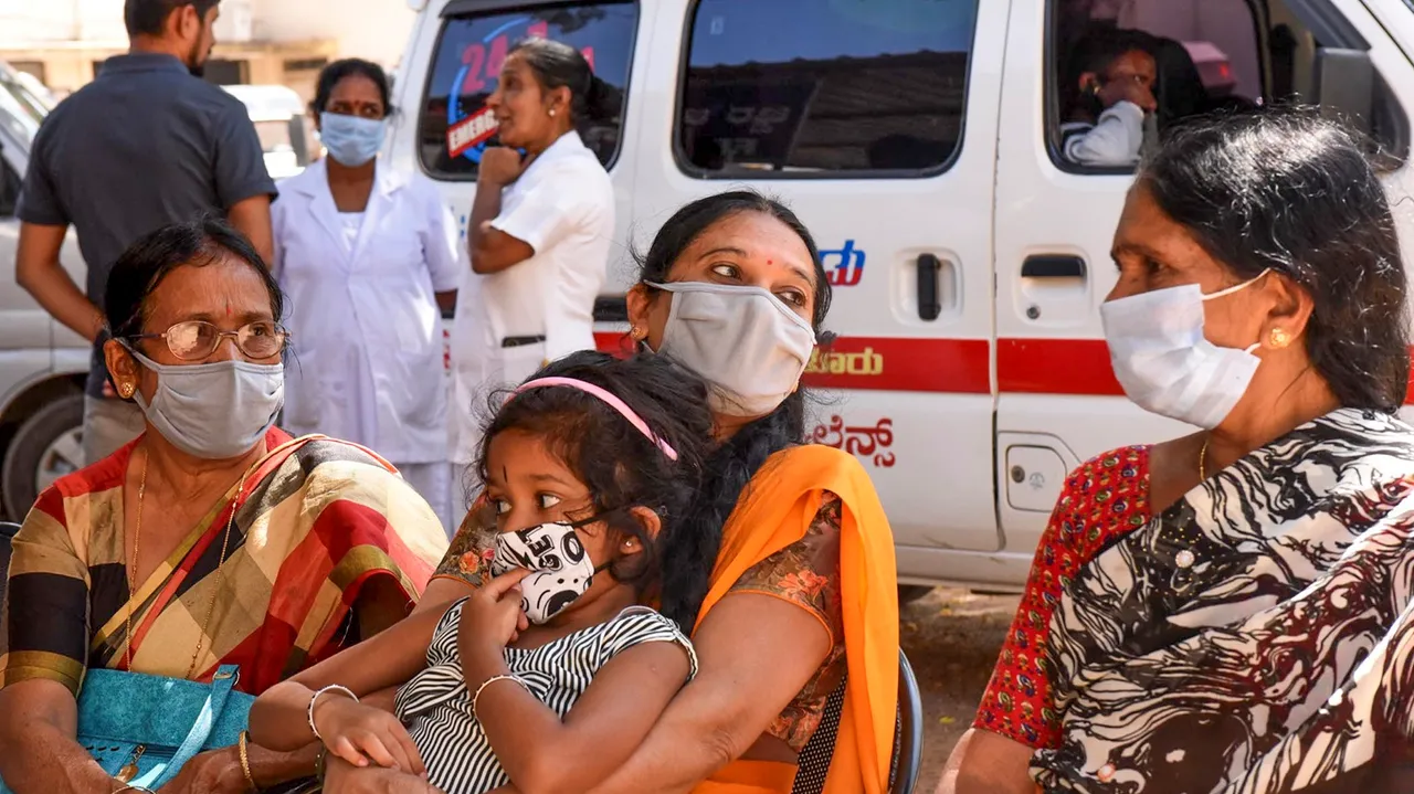 People wearing face masks as a precautionary measure after cases of COVID-19 sub-variant JN.1 were detected in the country, at a hospital in Chikkamagaluru