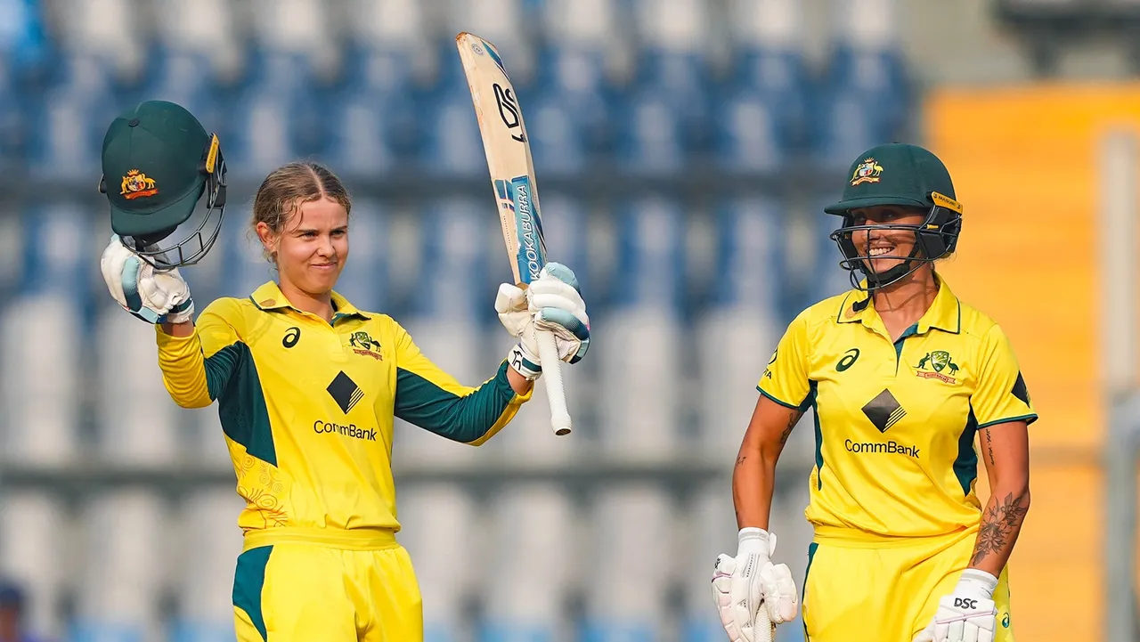 Australia's Phoebe Litchfield celebrates after scoring a century during the third ODI cricket match between India and Australia, at Wankhede Stadium