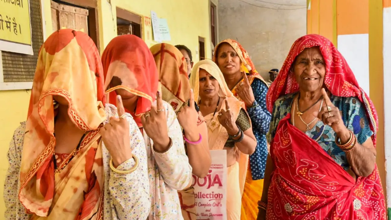 Voters show their fingers marked with indelible ink after casting their votes for the first phase of Lok Sabha elections, in Sikar, Friday, April 19, 2024