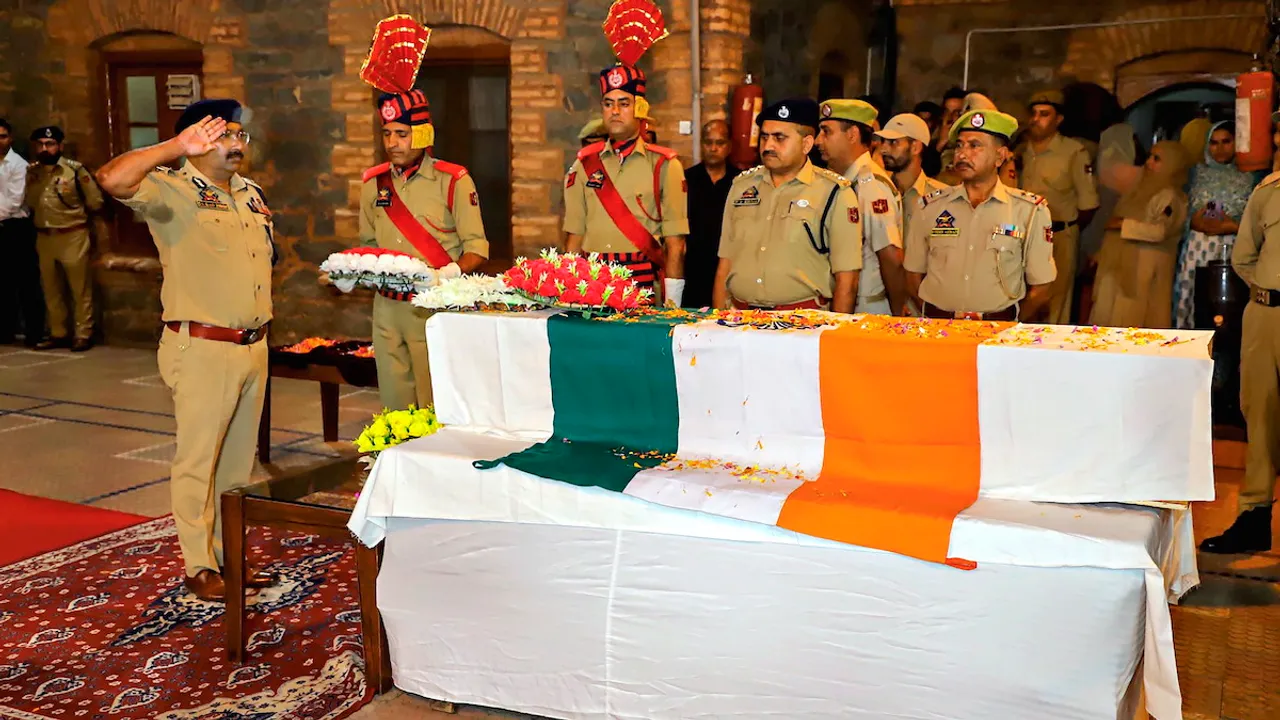 Jammu and Kashmir DGP Dilbag Singh pays homage by laying wreath on the mortal remains of Deputy Superintendent of Jammu and Kashmir Police Humayun Bhat who was killed in a gunfight with terrorists in Anantnag district, in Srinagar, Wednesday, Sept. 13, 2023.