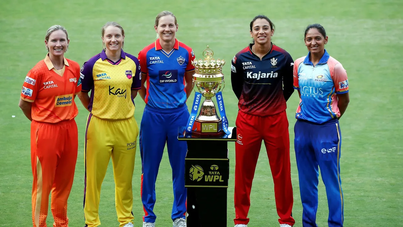 Captains of participating teams in the Women's Premier League 2024 with a trophy, in Bengaluru