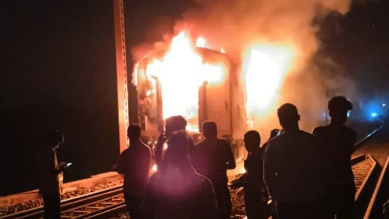 Flames and smoke rise after a fire broke out in a coach of a Holi special train near Ara station, in Bhojpur district, Bihar, Tuesday night, March 26, 2024