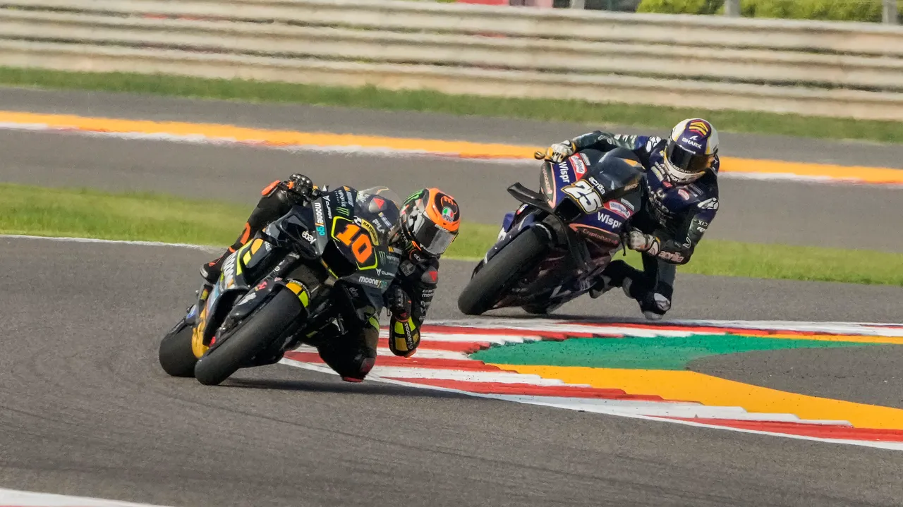 Luca Marini (10) of Mooney VR46 Racing Team and Raul Fernandez (25) CryptoDATA RNF MotoGP Team during a free practice session of MotoGP