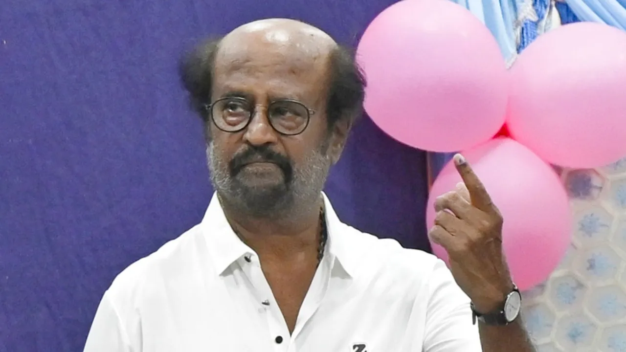 Veteran actor Rajinikanth shows his finger marked with indelible ink after casting his vote for the first phase of Lok Sabha elections, at a polling station in Chennai, Friday, April 19, 2024